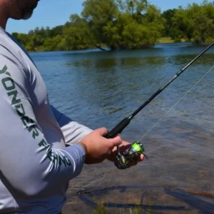 Close-up of an angler using the EdgeWalker 66MHT travel rod and spinning reel